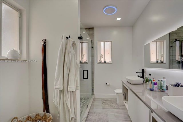 377 NE 34th Ter, Homestead, FL 33033 - full bath featuring a shower stall, baseboards, double vanity, toilet, and recessed lighting