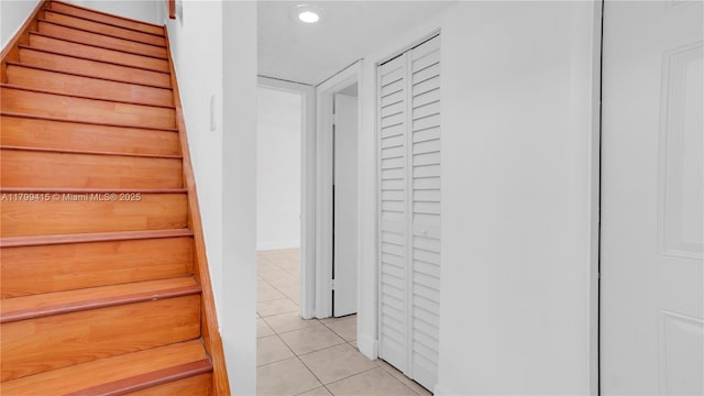stairs with tile patterned flooring and recessed lighting