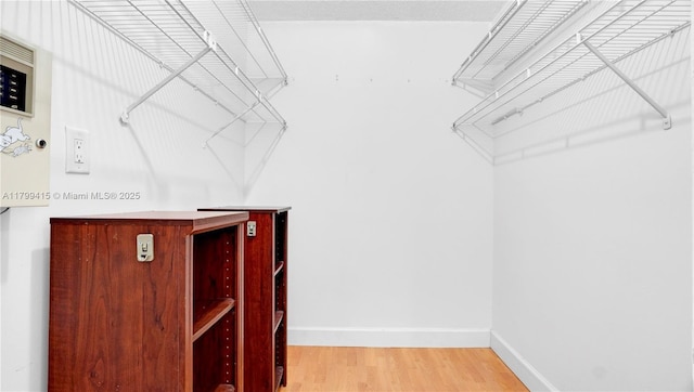 spacious closet featuring wood finished floors