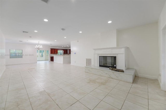 611 SW 8th St, Hallandale Beach, FL 33009 - unfurnished living room with recessed lighting, light tile patterned floors, a premium fireplace, a chandelier, and baseboards
