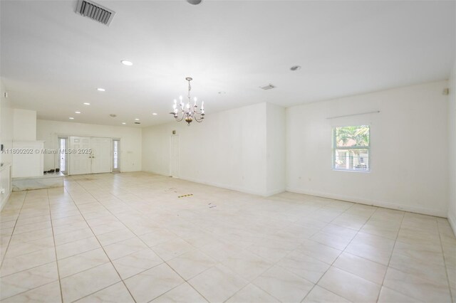 611 SW 8th St, Hallandale Beach, FL 33009 - empty room featuring recessed lighting, a chandelier, light tile patterned floors, and baseboards