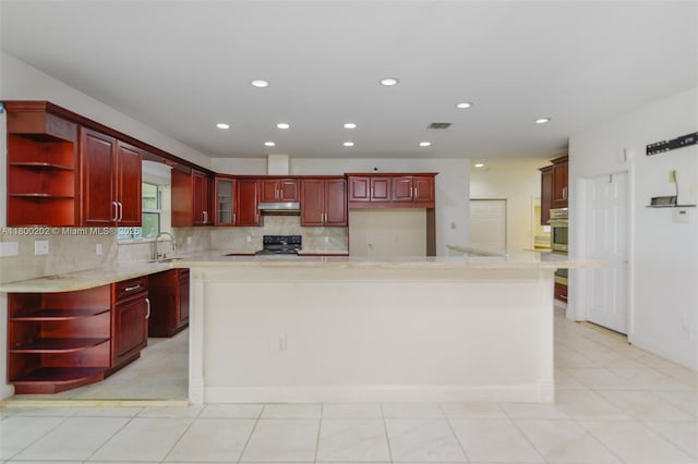 611 SW 8th St, Hallandale Beach, FL 33009 - kitchen featuring open shelves, reddish brown cabinets, under cabinet range hood, and recessed lighting