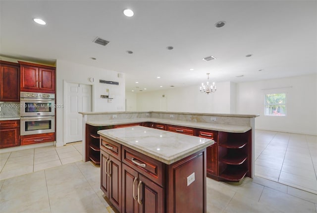 611 SW 8th St, Hallandale Beach, FL 33009 - kitchen featuring dark brown cabinets, a center island, double oven, a chandelier, and open shelves
