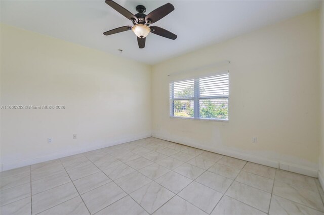 611 SW 8th St, Hallandale Beach, FL 33009 - empty room with ceiling fan, light tile patterned flooring, and baseboards