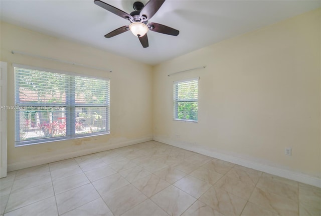 611 SW 8th St, Hallandale Beach, FL 33009 - empty room featuring ceiling fan, baseboards, and light tile patterned flooring