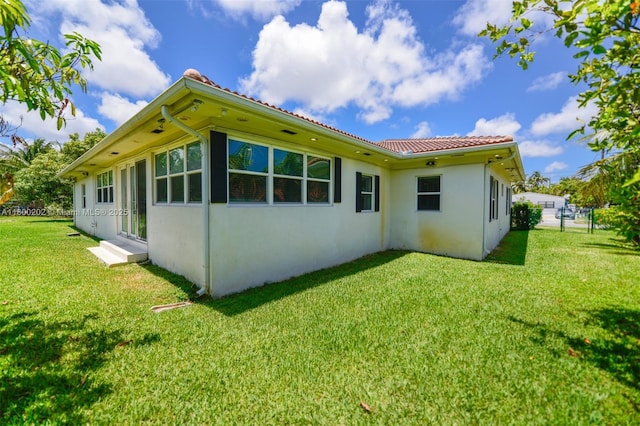 611 SW 8th St, Hallandale Beach, FL 33009 - view of side of home with stucco siding