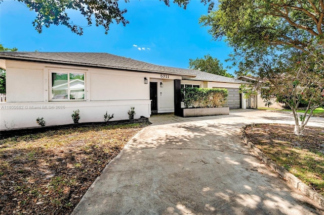 5711 SW 118th Ave, Cooper City, FL 33330 - ranch-style home featuring a garage, concrete driveway, and stucco siding
