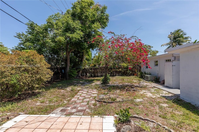 view of yard with fence and a patio
