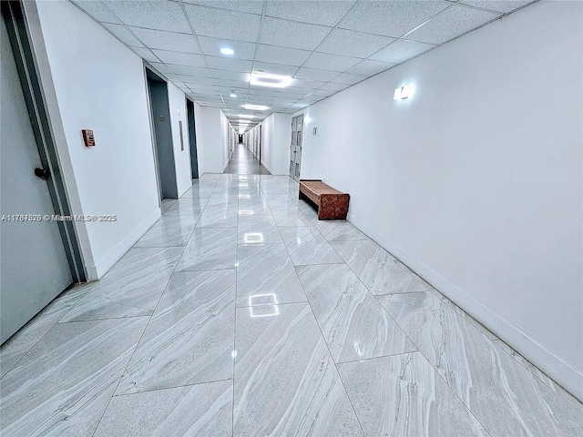 4200 Hillcrest Dr Unit 1017, Hollywood, FL 33021 - hall with light marble finish floors, baseboards, and a paneled ceiling