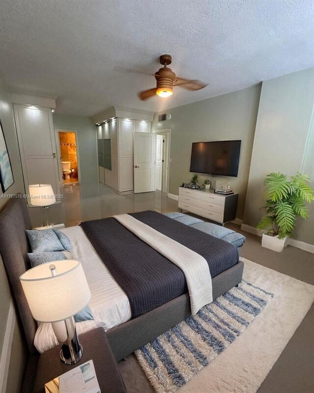 4200 Hillcrest Dr Unit 1017, Hollywood, FL 33021 - bedroom with a textured ceiling, baseboards, and a ceiling fan