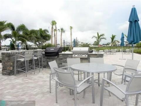 4200 Hillcrest Dr Unit 1017, Hollywood, FL 33021 - view of patio with outdoor dining area