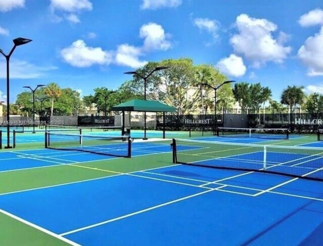 4200 Hillcrest Dr Unit 1017, Hollywood, FL 33021 - view of tennis court with community basketball court