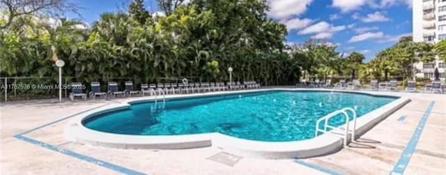 4200 Hillcrest Dr Unit 1017, Hollywood, FL 33021 - community pool with a patio and view of wooded area