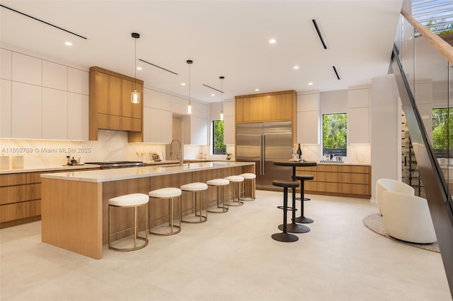 2905 Washington St, Miami, FL 33133 - kitchen featuring modern cabinets, stainless steel appliances, a sink, a large island, and recessed lighting