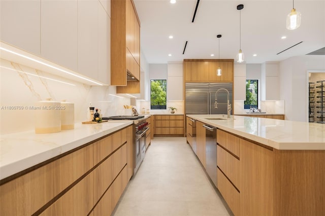 2905 Washington St, Miami, FL 33133 - kitchen with modern cabinets, high quality appliances, tasteful backsplash, light stone countertops, and healthy amount of natural light