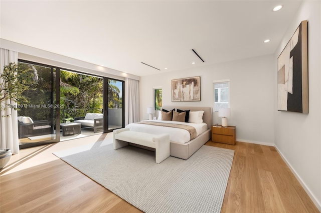 2905 Washington St, Miami, FL 33133 - bedroom with access to outside, light wood-type flooring, multiple windows, baseboards, and recessed lighting