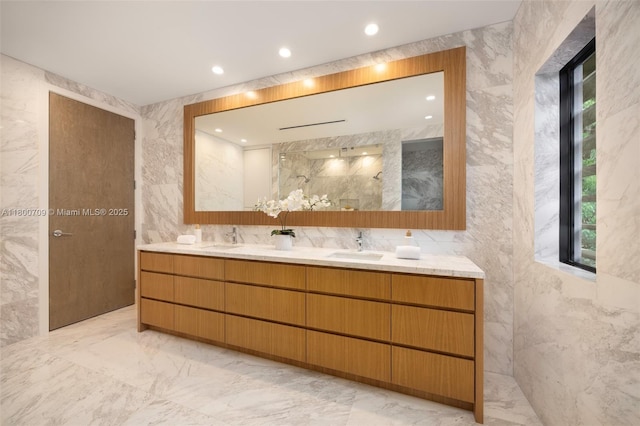 2905 Washington St, Miami, FL 33133 - bathroom with marble tiled flooring, plenty of natural light, a marble finish shower, double vanity, and tile walls