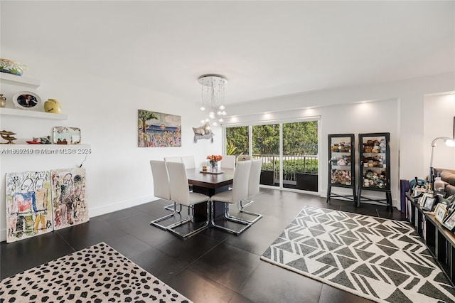 1700 NE 105th St Unit 108, Miami Shores, FL 33138 - dining room featuring a chandelier, tile patterned floors, and baseboards