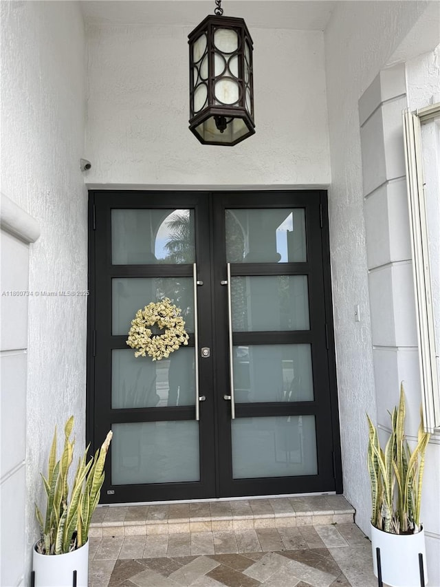 8389 NW 115th Ct, Doral, FL 33178 - doorway to property featuring french doors and stucco siding