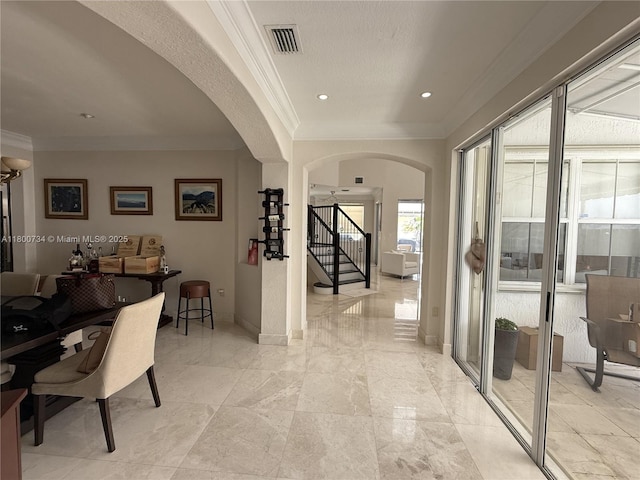 8389 NW 115th Ct, Doral, FL 33178 - hallway with ornamental molding, arched walkways, stairs, baseboards, and recessed lighting