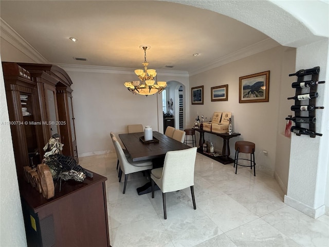 8389 NW 115th Ct, Doral, FL 33178 - dining area featuring arched walkways, a chandelier, ornamental molding, and baseboards