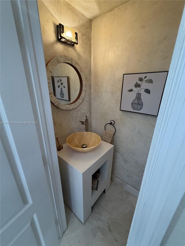 8389 NW 115th Ct, Doral, FL 33178 - bathroom with concrete floors and vanity