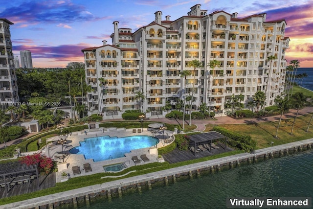 5266 Fisher Island Dr Unit 5266, Miami Beach, FL 33109 - community pool with a water view and a patio area