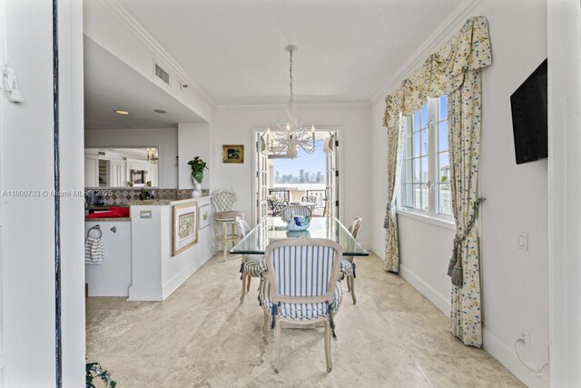 5266 Fisher Island Dr Unit 5266, Miami Beach, FL 33109 - dining space with a chandelier and crown molding