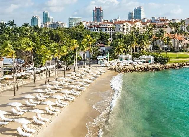 5266 Fisher Island Dr Unit 5266, Miami Beach, FL 33109 - view of community with view of water and beach and a skyline view
