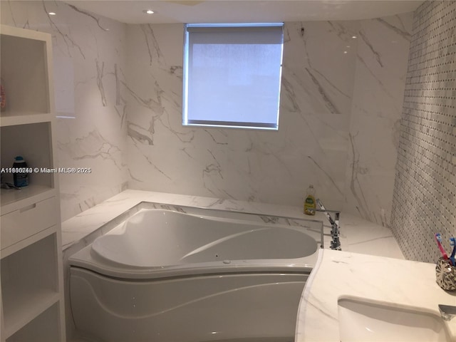 16485 Collins Ave Unit 538, Sunny Isles Beach, FL 33160 - bathroom featuring a garden tub and vanity