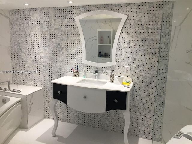 16485 Collins Ave Unit 538, Sunny Isles Beach, FL 33160 - bathroom featuring vanity, a garden tub, and recessed lighting