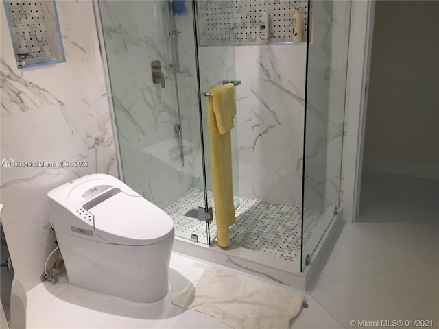 16485 Collins Ave Unit 538, Sunny Isles Beach, FL 33160 - bathroom with a marble finish shower and tile walls