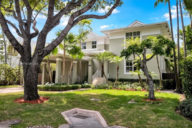164 W Mashta Dr, Key Biscayne, FL 33149 - view of front of house with stucco siding and a front lawn