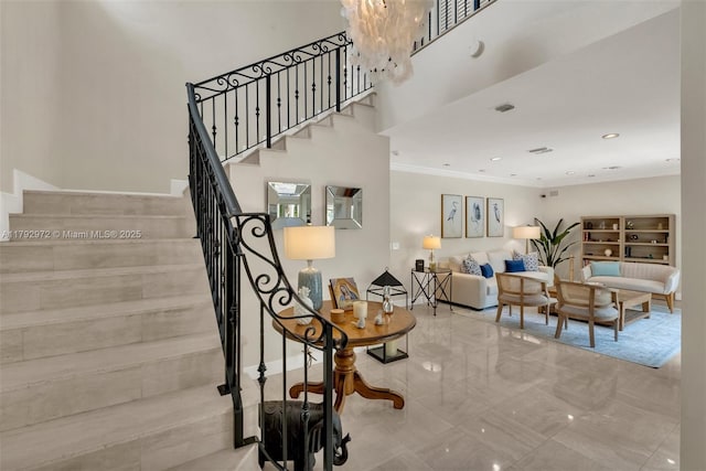 164 W Mashta Dr, Key Biscayne, FL 33149 - stairway with ornamental molding, a chandelier, recessed lighting, and a high ceiling