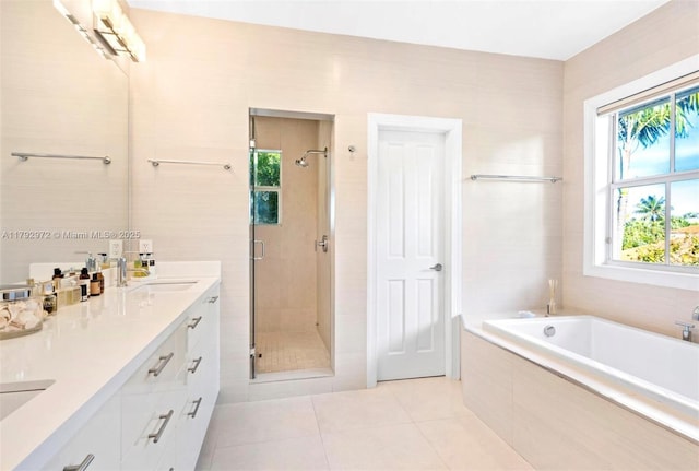 164 W Mashta Dr, Key Biscayne, FL 33149 - full bathroom with a stall shower, double vanity, tile patterned floors, and a garden tub