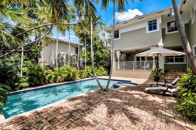 164 W Mashta Dr, Key Biscayne, FL 33149 - view of pool featuring a patio and a pool with connected hot tub