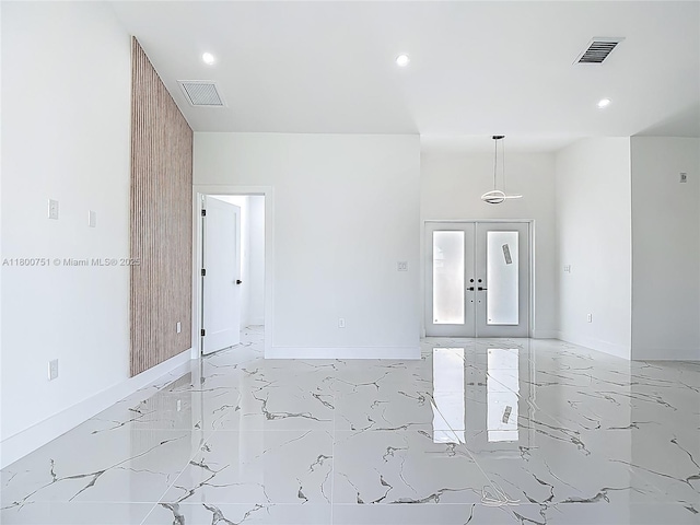 empty room with light marble finish floors, recessed lighting, french doors, and baseboards