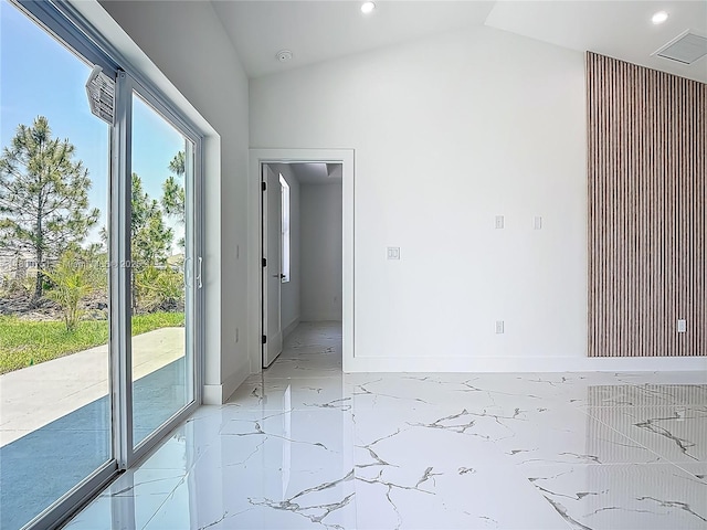 unfurnished room featuring light marble finish floors, lofted ceiling, recessed lighting, and baseboards