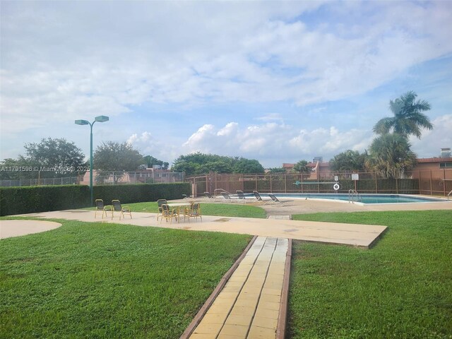 29 Seville Cir Unit 4-49, Davie, FL 33324 - view of property's community with a swimming pool and a patio