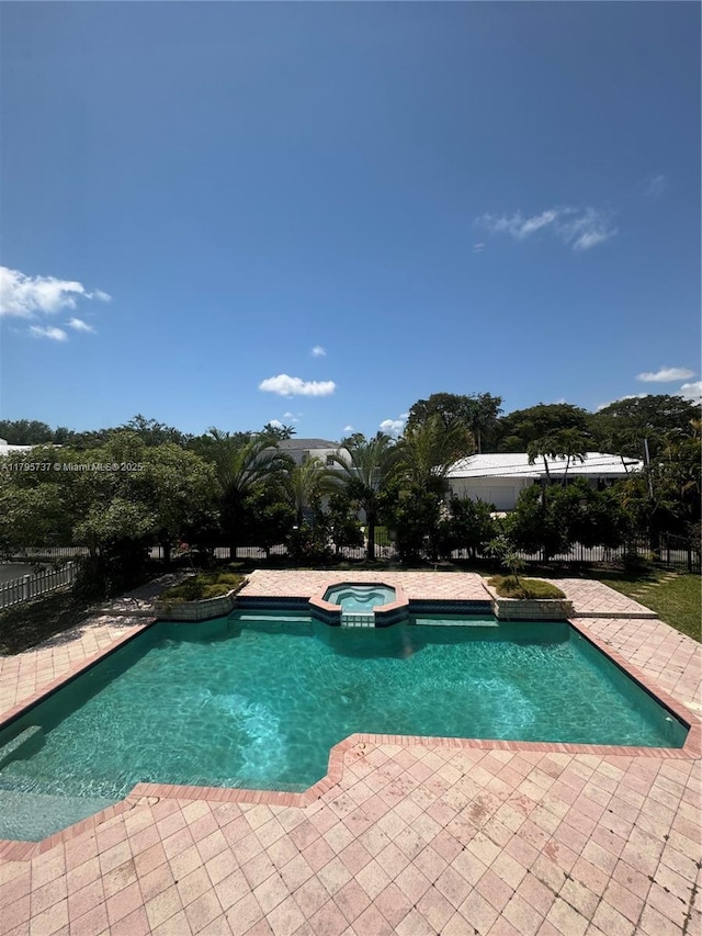 1234 NE 96th St, Miami Shores, FL 33138 - view of pool with a pool with connected hot tub and a patio area