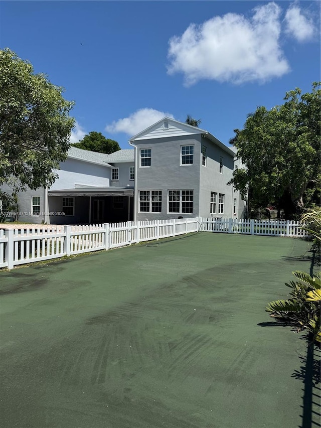 1234 NE 96th St, Miami Shores, FL 33138 - rear view of house with stucco siding