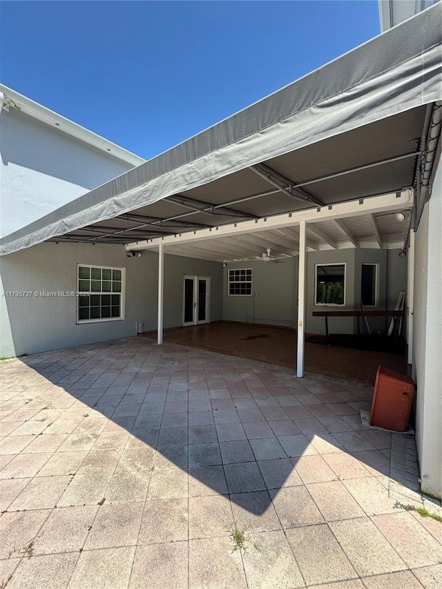 1234 NE 96th St, Miami Shores, FL 33138 - view of patio with french doors and a carport