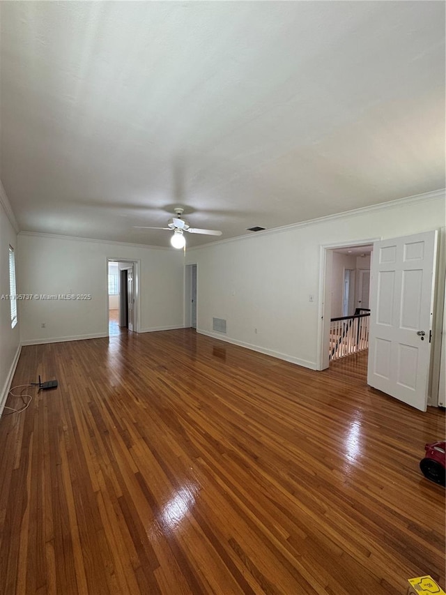 1234 NE 96th St, Miami Shores, FL 33138 - unfurnished living room featuring hardwood / wood-style flooring, ornamental molding, baseboards, a ceiling fan, and healthy amount of natural light