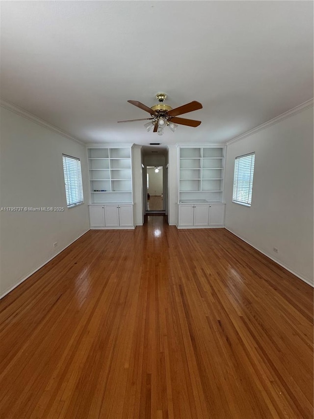 1234 NE 96th St, Miami Shores, FL 33138 - unfurnished room with built in features, a ceiling fan, wood finished floors, and crown molding
