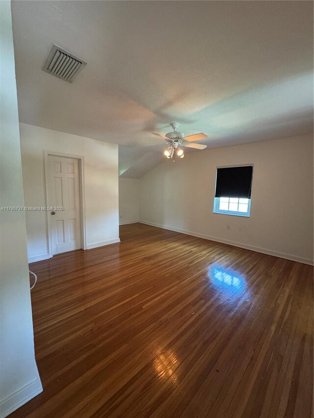 1234 NE 96th St, Miami Shores, FL 33138 - empty room with a ceiling fan, dark wood-style floors, baseboards, and lofted ceiling