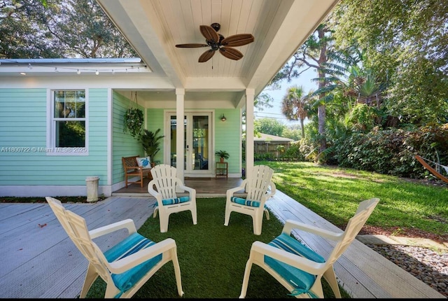 view of patio featuring a ceiling fan and a deck