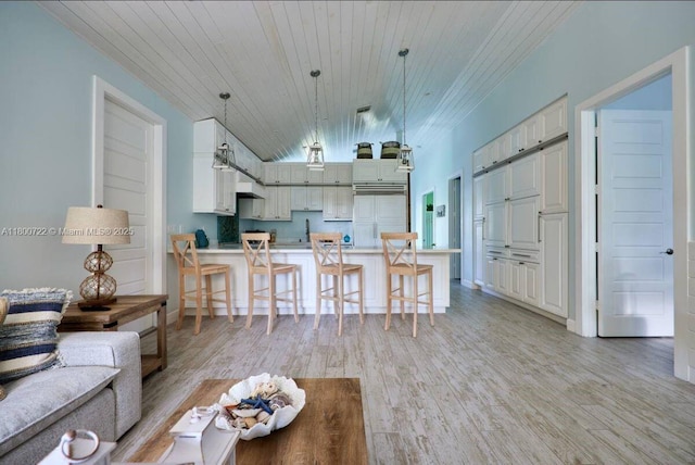 living room with wood ceiling, light wood-style flooring, and lofted ceiling