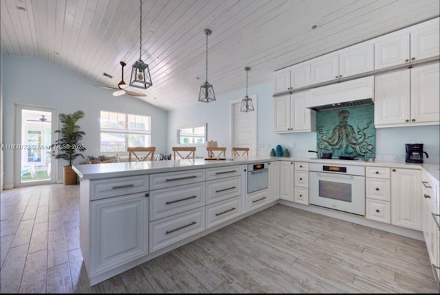 kitchen featuring white oven, a peninsula, wooden ceiling, light wood-type flooring, and vaulted ceiling