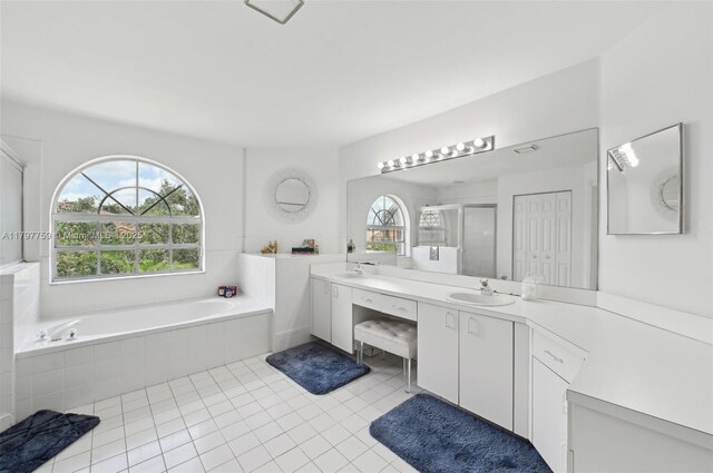18417 NW 9th Ct, Pembroke Pines, FL 33029 - bathroom with a stall shower, a garden tub, vanity, and tile patterned floors