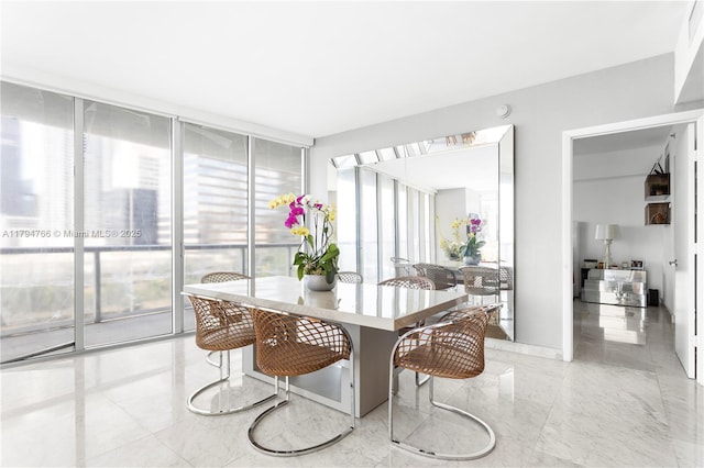 495 Brickell Ave Unit 1001, Miami, FL 33131 - dining space featuring marble tiled floors and expansive windows